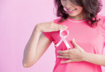 Cancer Survivor Says Cannabis Use “Was The Best Thing” woman with breast cancer ribbon 1 cancer survivor